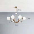 Noctivox 6-light chandelier in brushed gold — dimensions O82cm, drop 50cm, globe O15cm