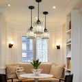 Nzavor crystal cylinder pendants – black finish, staggered above a window bench