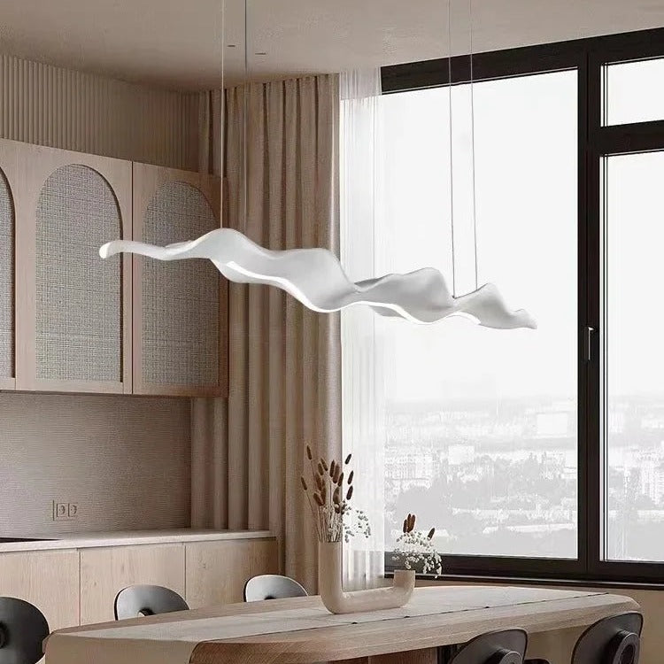 Sculptural wave-form pendant light Velorix white finish over kitchen island