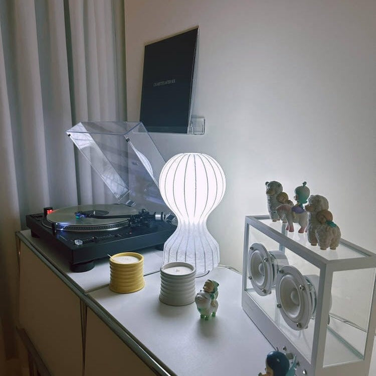 Rittara pleated silk table lamp – small size on wooden bedside table