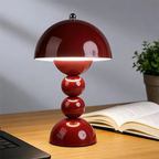 Velvara stacked sphere rechargeable table lamp – wine-red lacquered balls on white desk