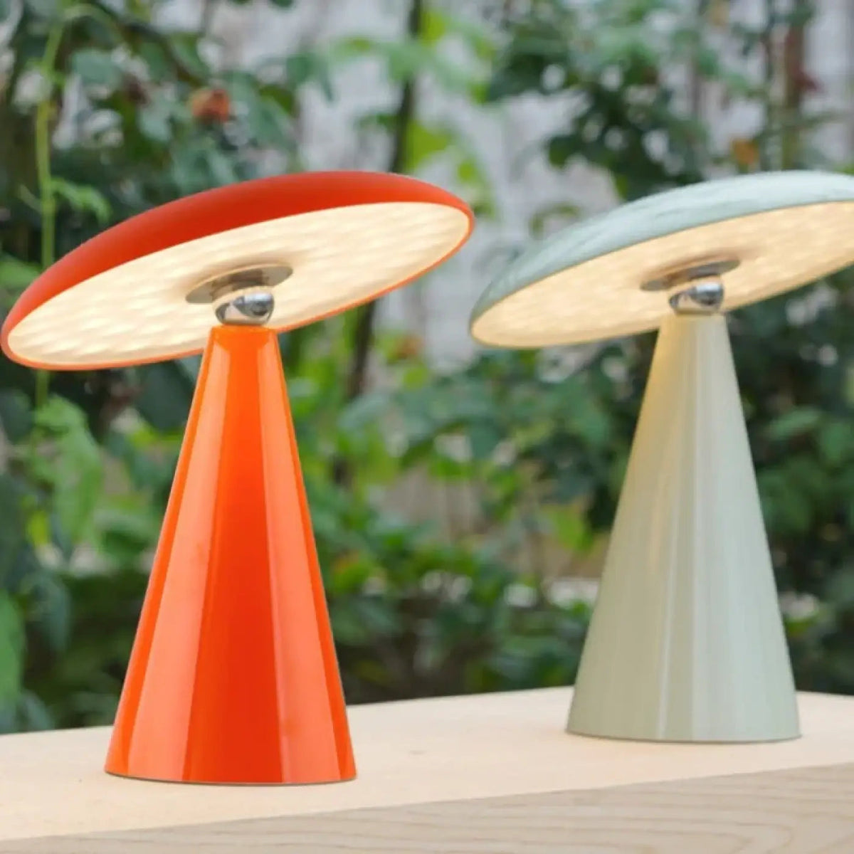 Vitara retro mushroom saucer table lamp – Amber Orange and Sage Green on outdoor table