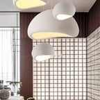 Sculptural Textured Pebble Pendant Light Wysalis by Cletya hanging in minimalist interior space