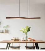 Yalvix wave-form linear pendant, 90 cm, warm white glow over a dining table